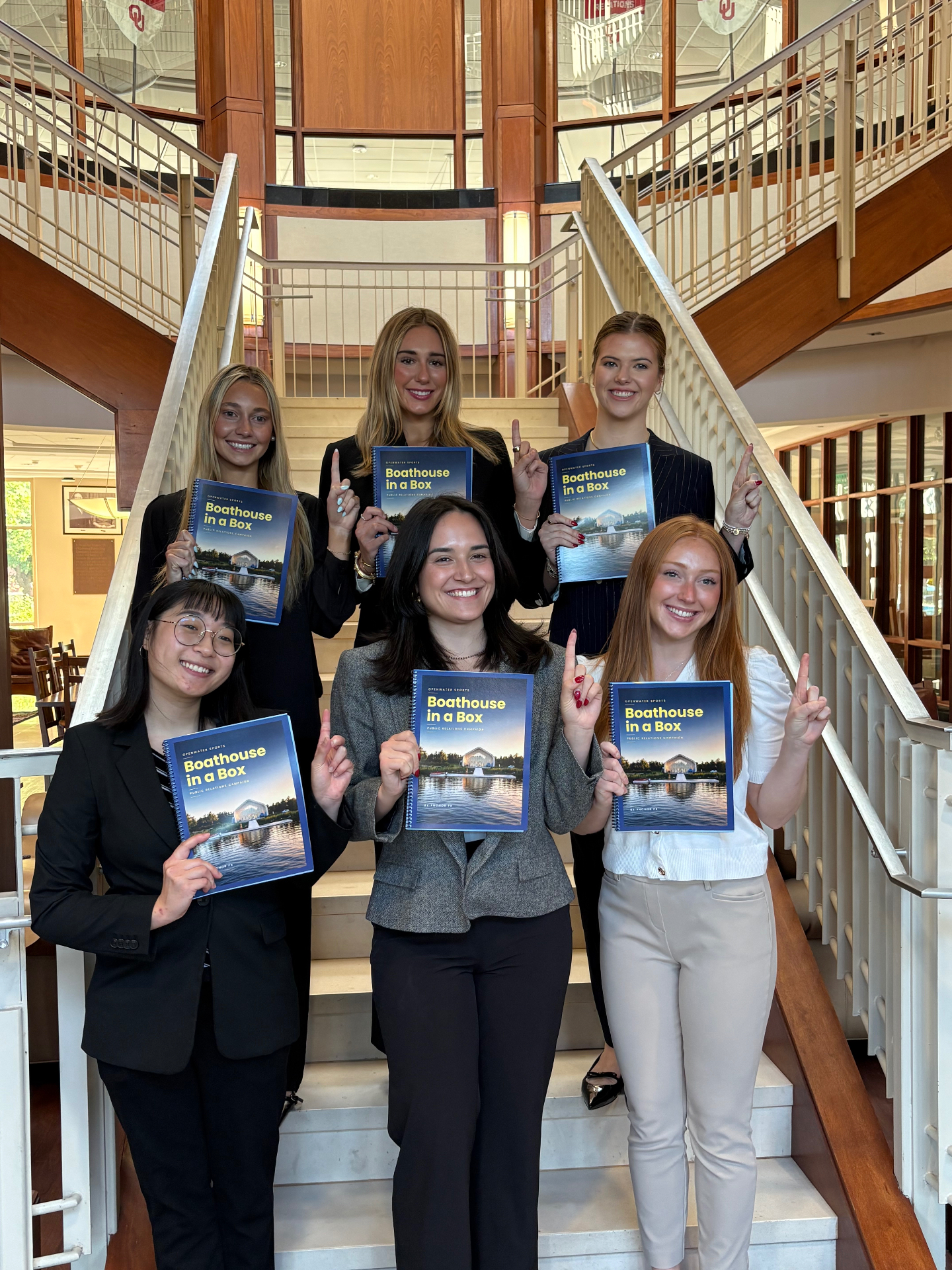 Kayln with her Boathouse in a Box campaign team at OU